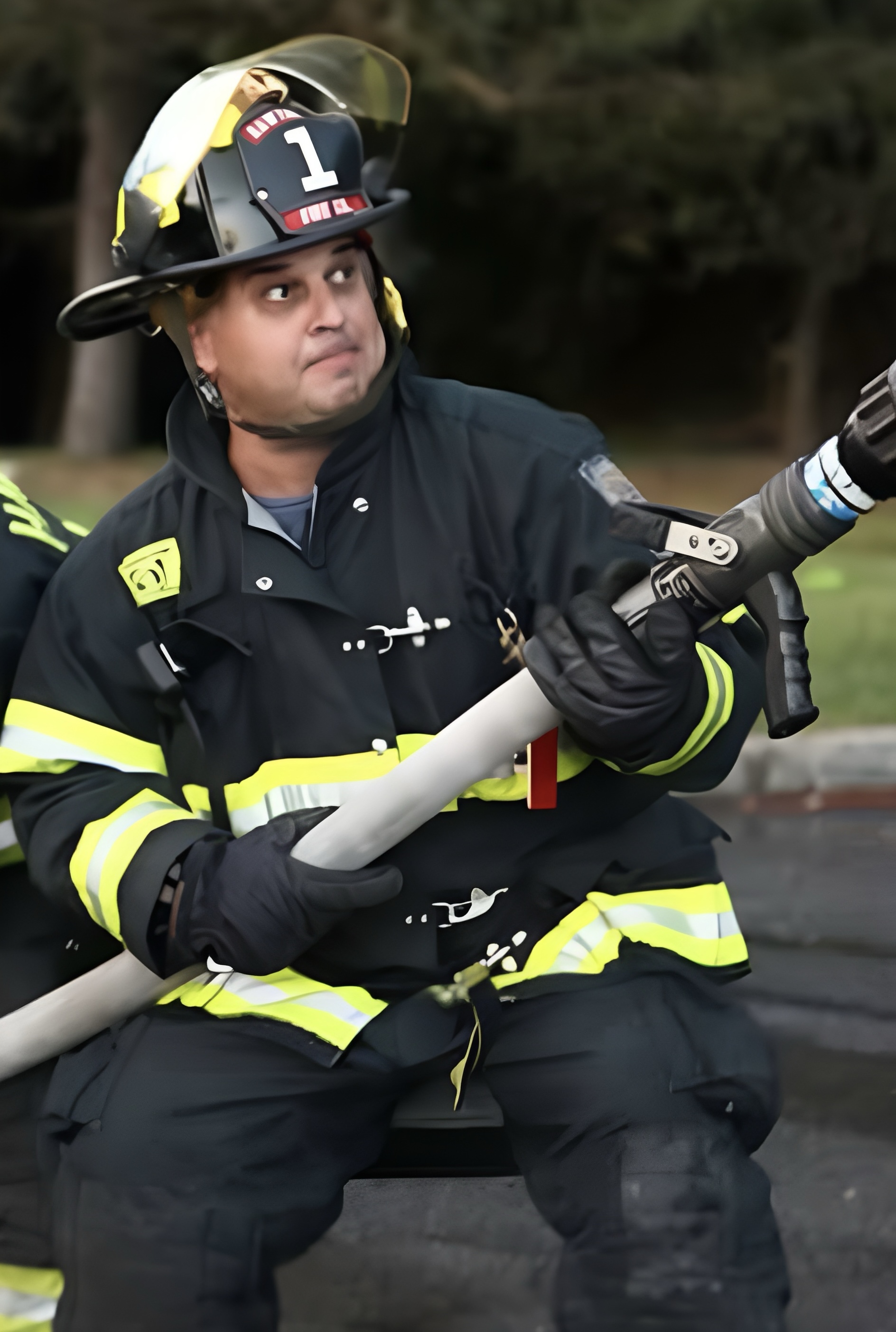 Action shot of Vinny Grolli, a volunteer firefighter with the Hawthorne Fire Department
